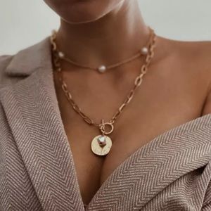 Multilayered pearl necklace and choker